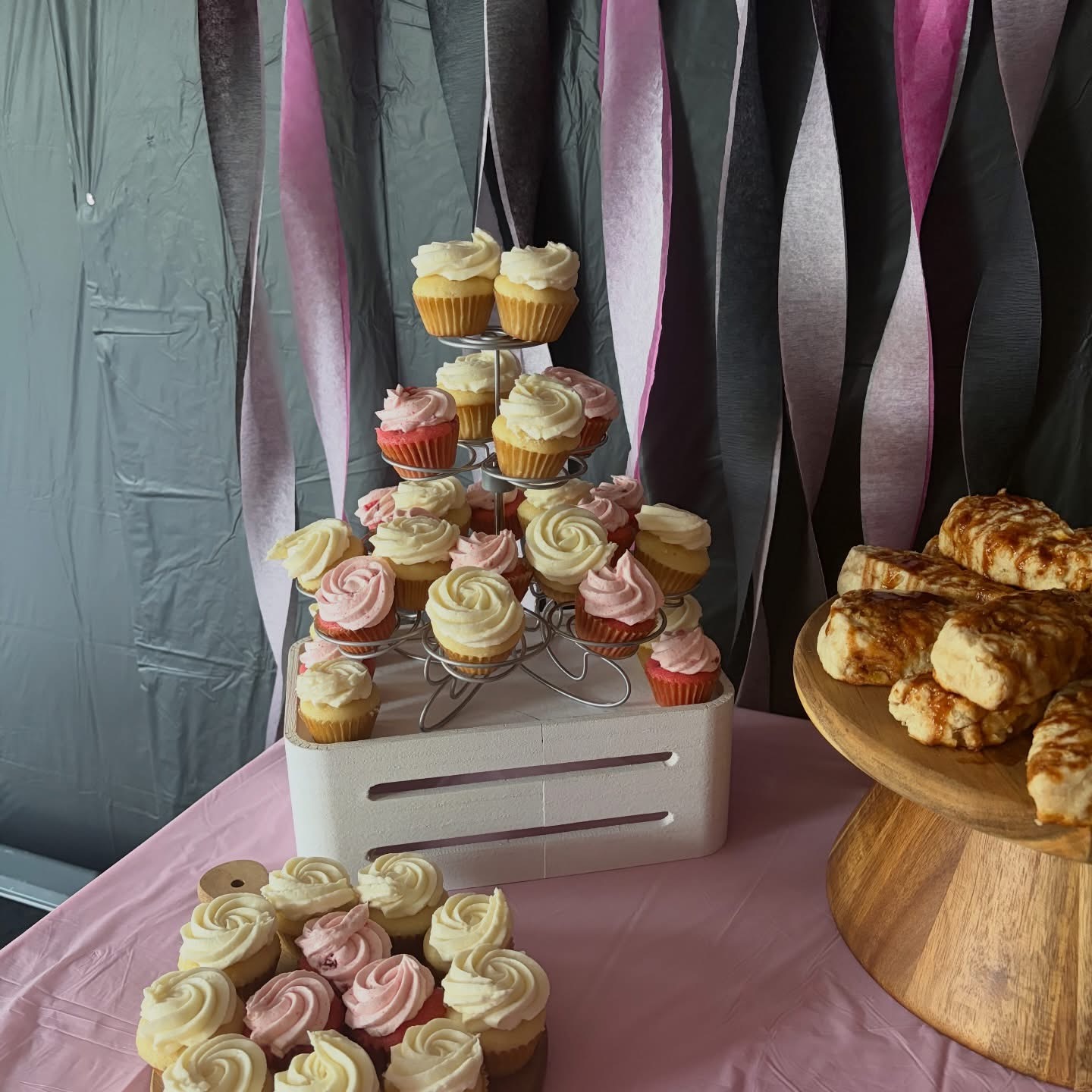 Tower of vanilla and strawberry cupcakes at an event